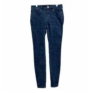 White House Black Market mid-rise animal print skinny jeans. Size 6.